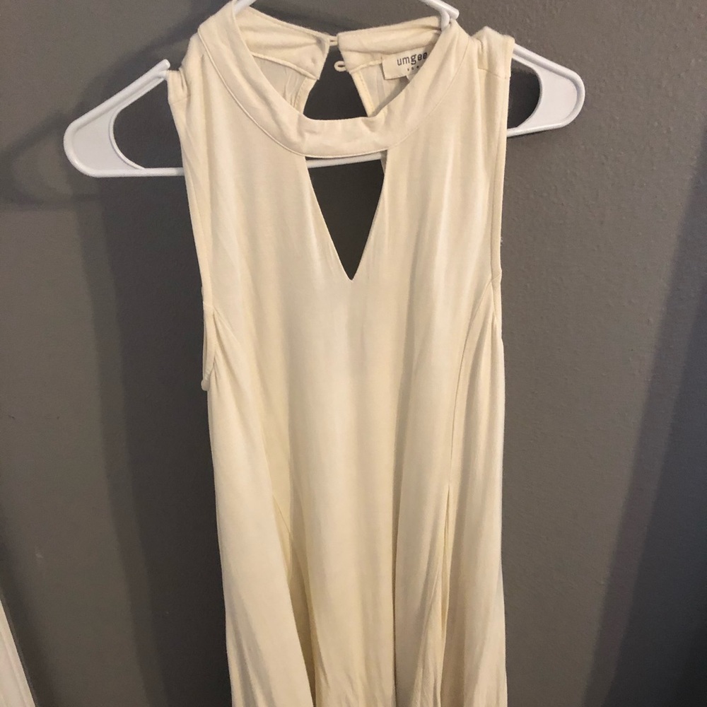 Lace trim bottom white dress with back cut out.